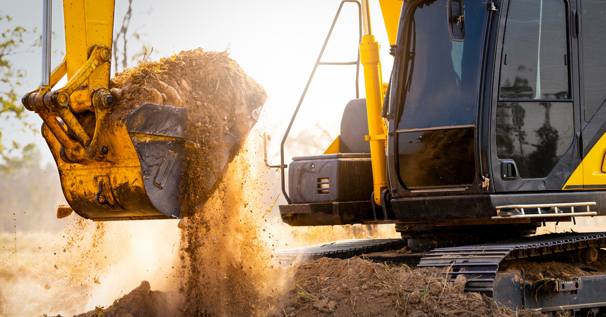 a truck driving down a dirt road