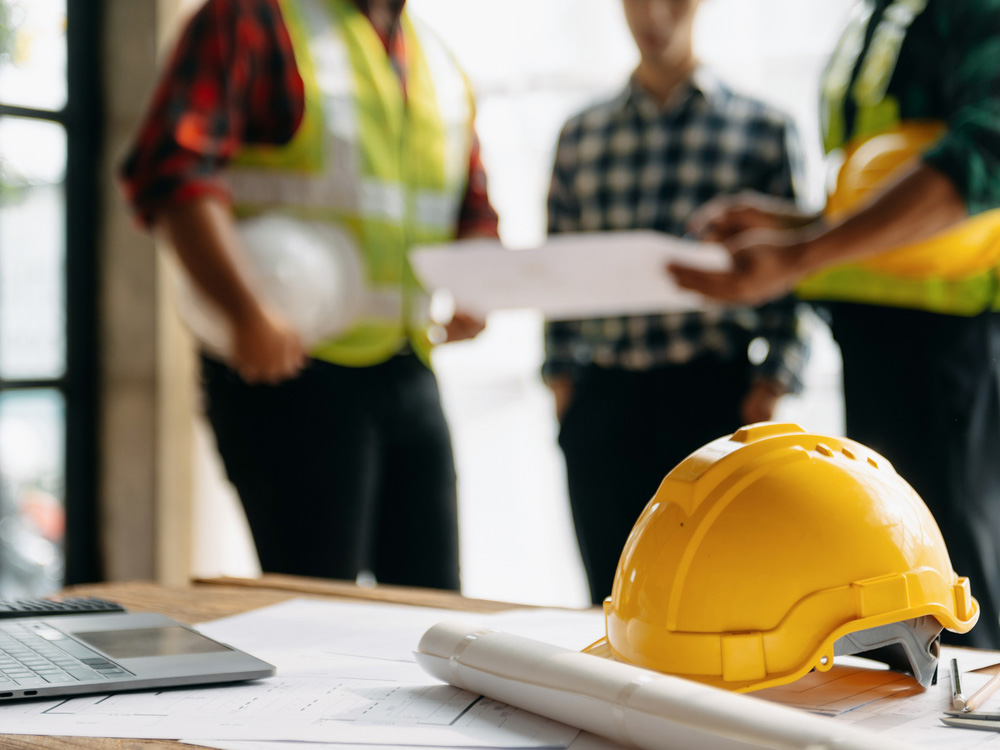 a group of people standing around a table
