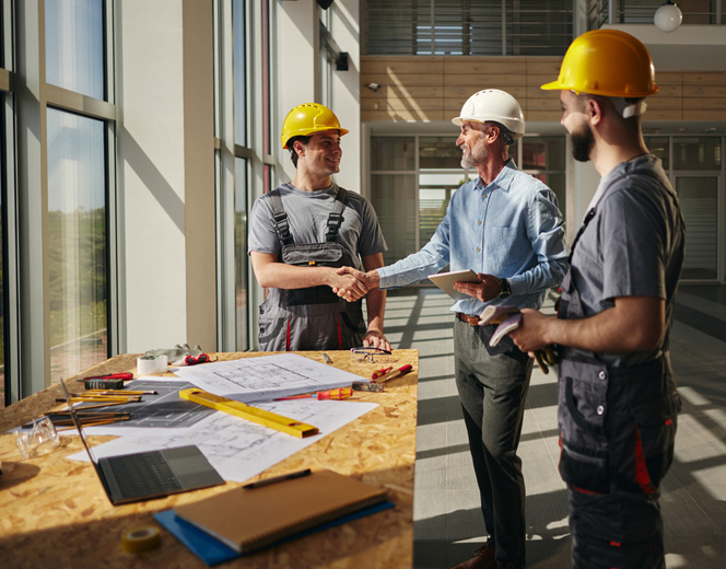 a man standing next to a building