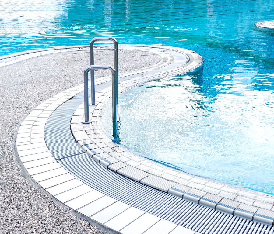 a pool next to a body of water