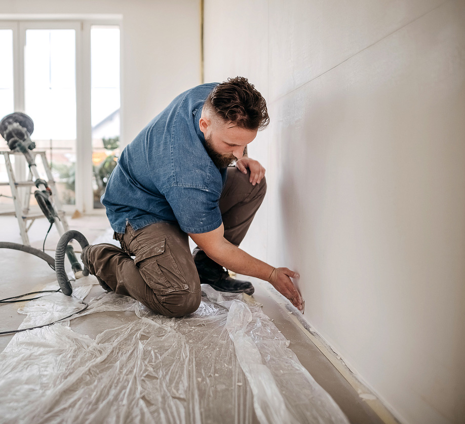 a man sitting on a bed