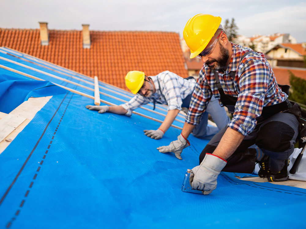 a man sitting at a table with a blue ball