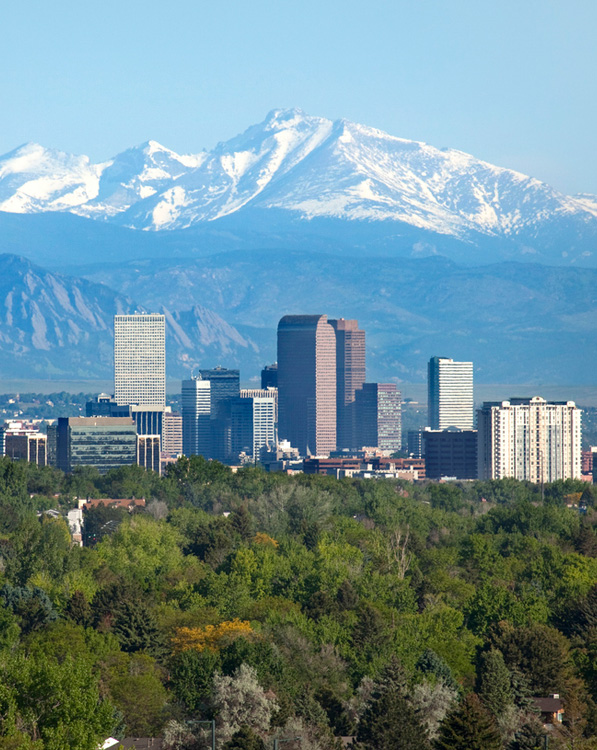 a large body of water with a city in the background