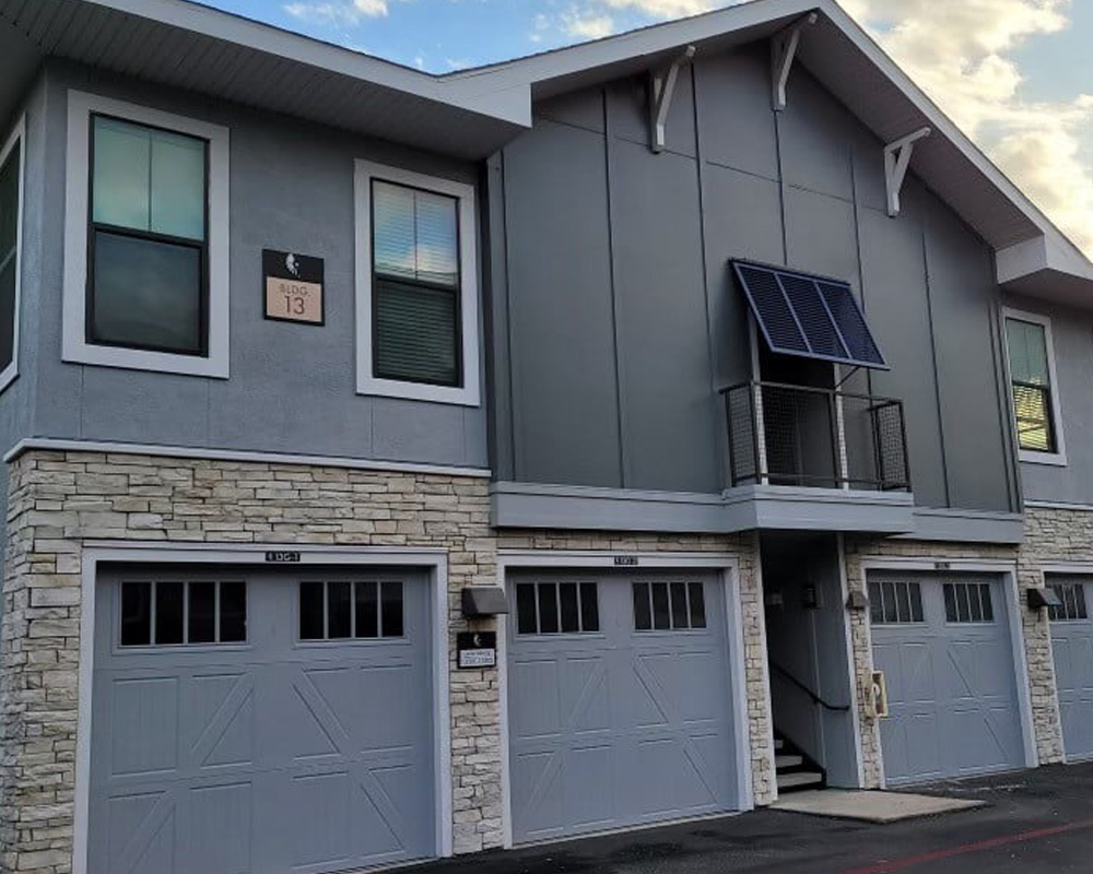 a house that is parked on the side of a building