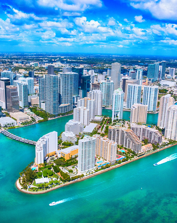 a large body of water with a city in the background