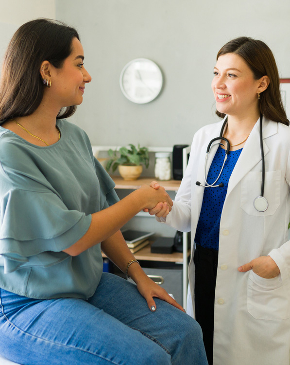 a group of people standing next to a woman