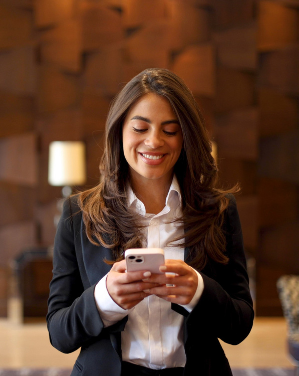 a woman holding a cell phone
