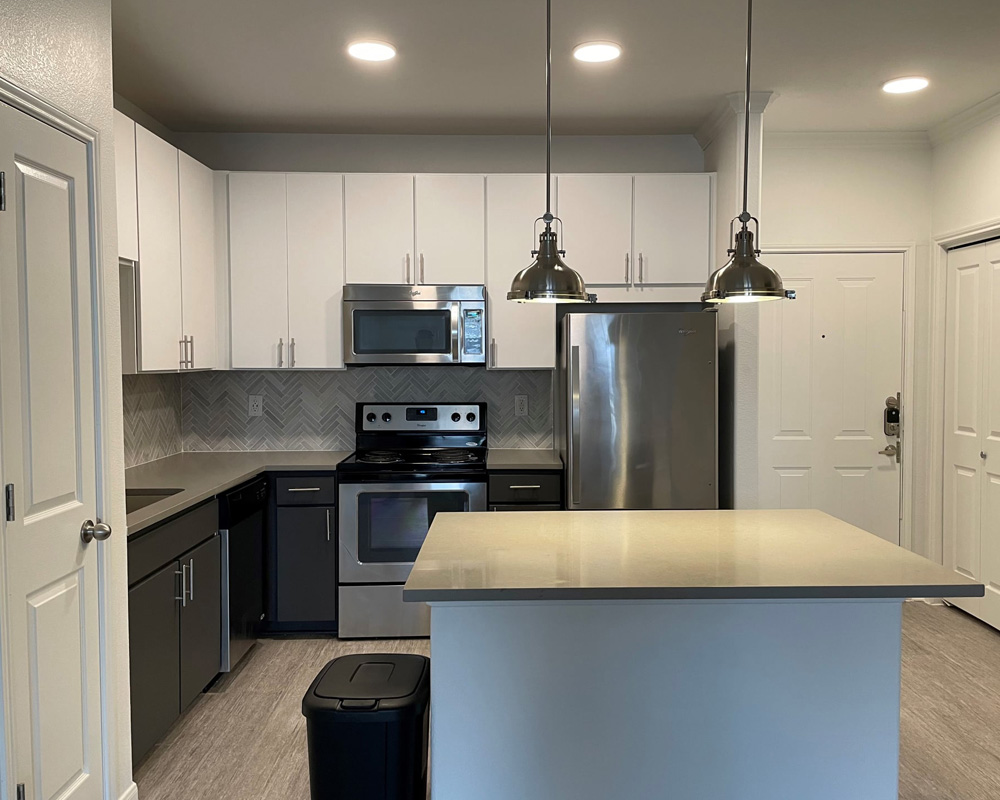 a modern kitchen with stainless steel appliances