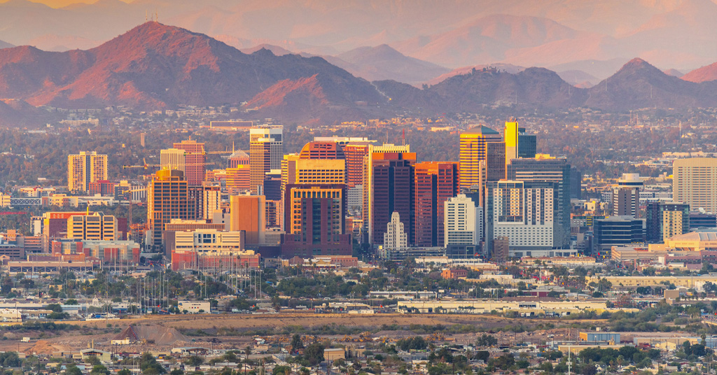 a large body of water with a city in the background