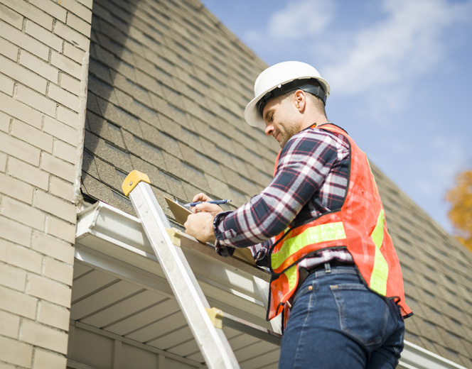 a person riding on top of a building