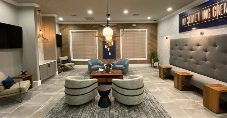 a large room filled with furniture and a fireplace