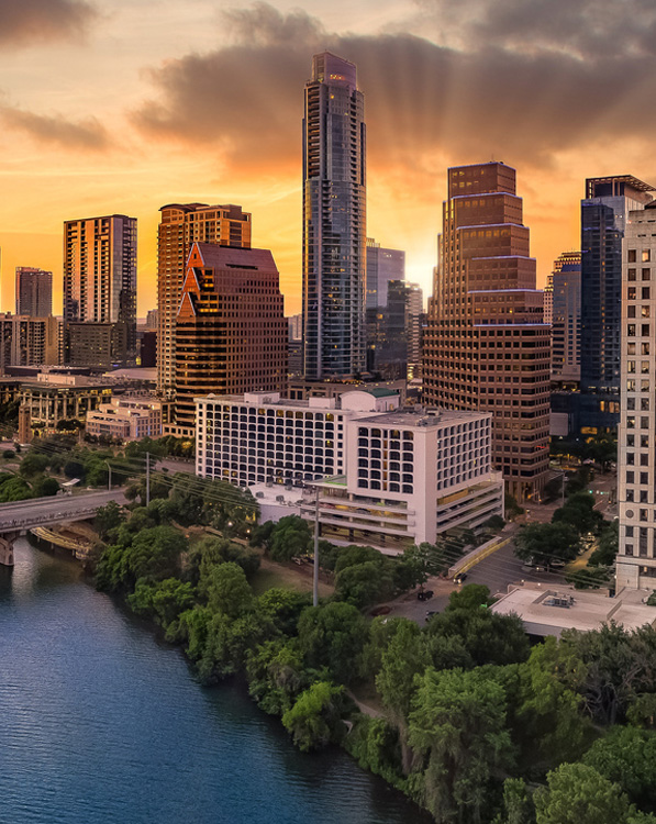 a large body of water with a city in the background