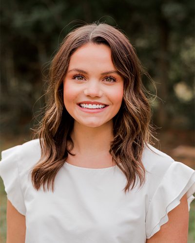 a woman smiling for the camera