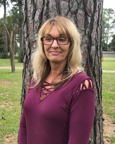 a woman posing in a park