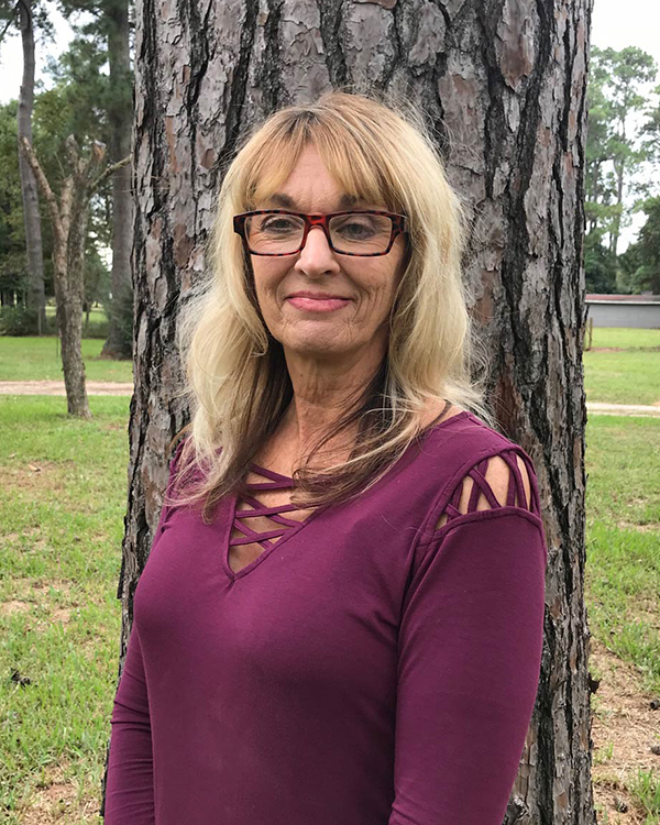 a woman posing in a park